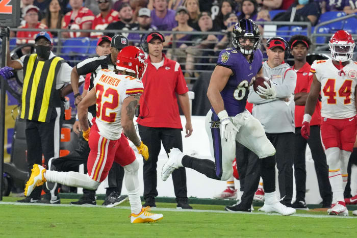 Baltimore Ravens tight end Mark Andrews (89) runs for a third quarter gain after his catch defended by Kansas City Chiefs safety Tyrann Mathieu (32) at M&T Bank Stadium. Mandatory Credit: Mitch Stringer-USA TODAY Sports
